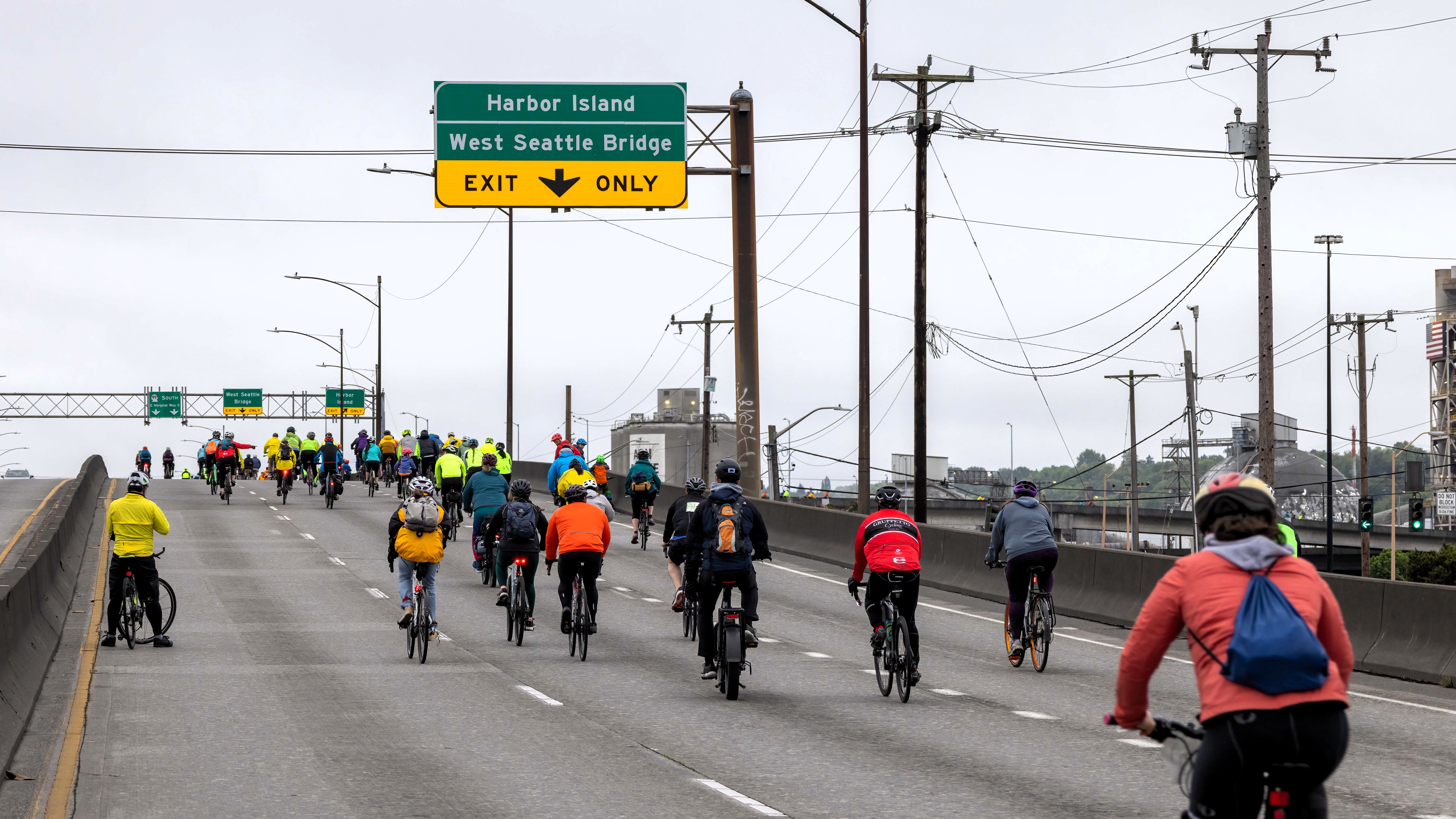 People on bikes heading up to the West Seattle Bridge